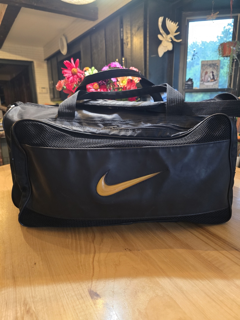 O Nike Black Duffel with Gold Swoosh
